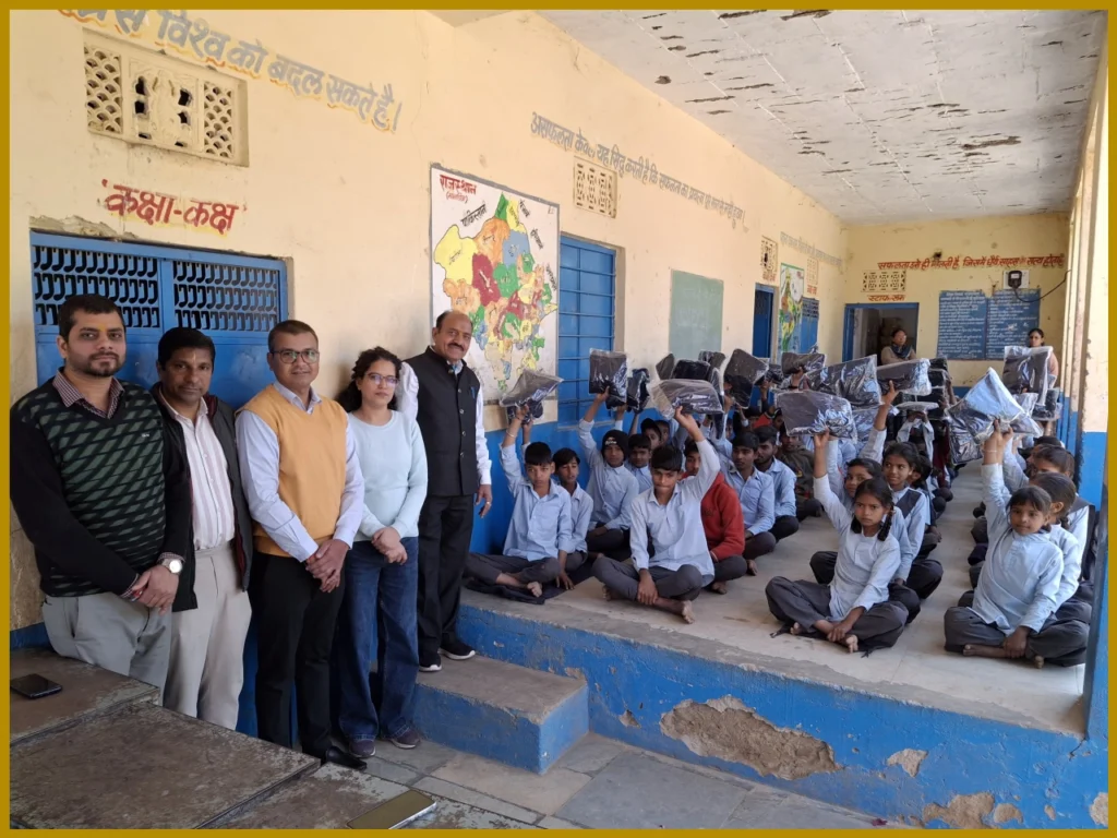 LIC Agents Distribute Sweaters to Students in Udaipur